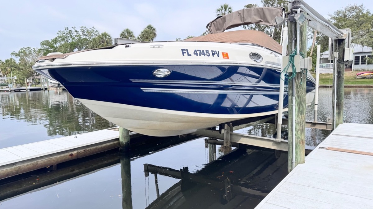 Blue boat with a polished exterior finish after Detail Dudez boat detailing