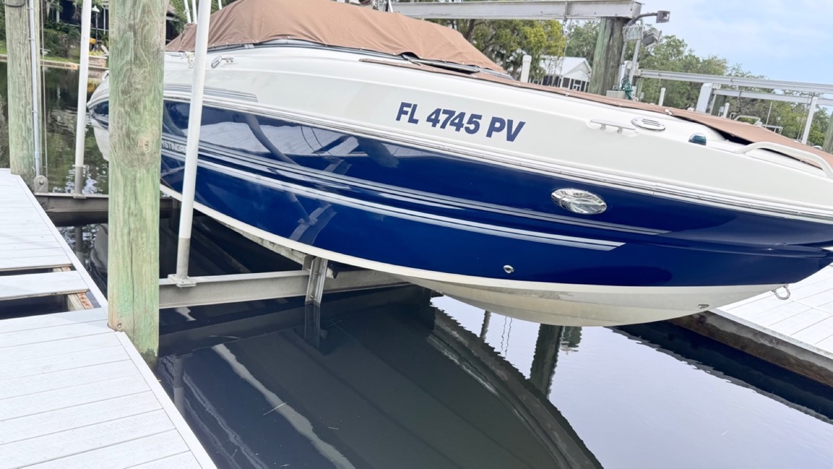 Blue boat with a glossy exterior finish after Detail Dudez boat detailing